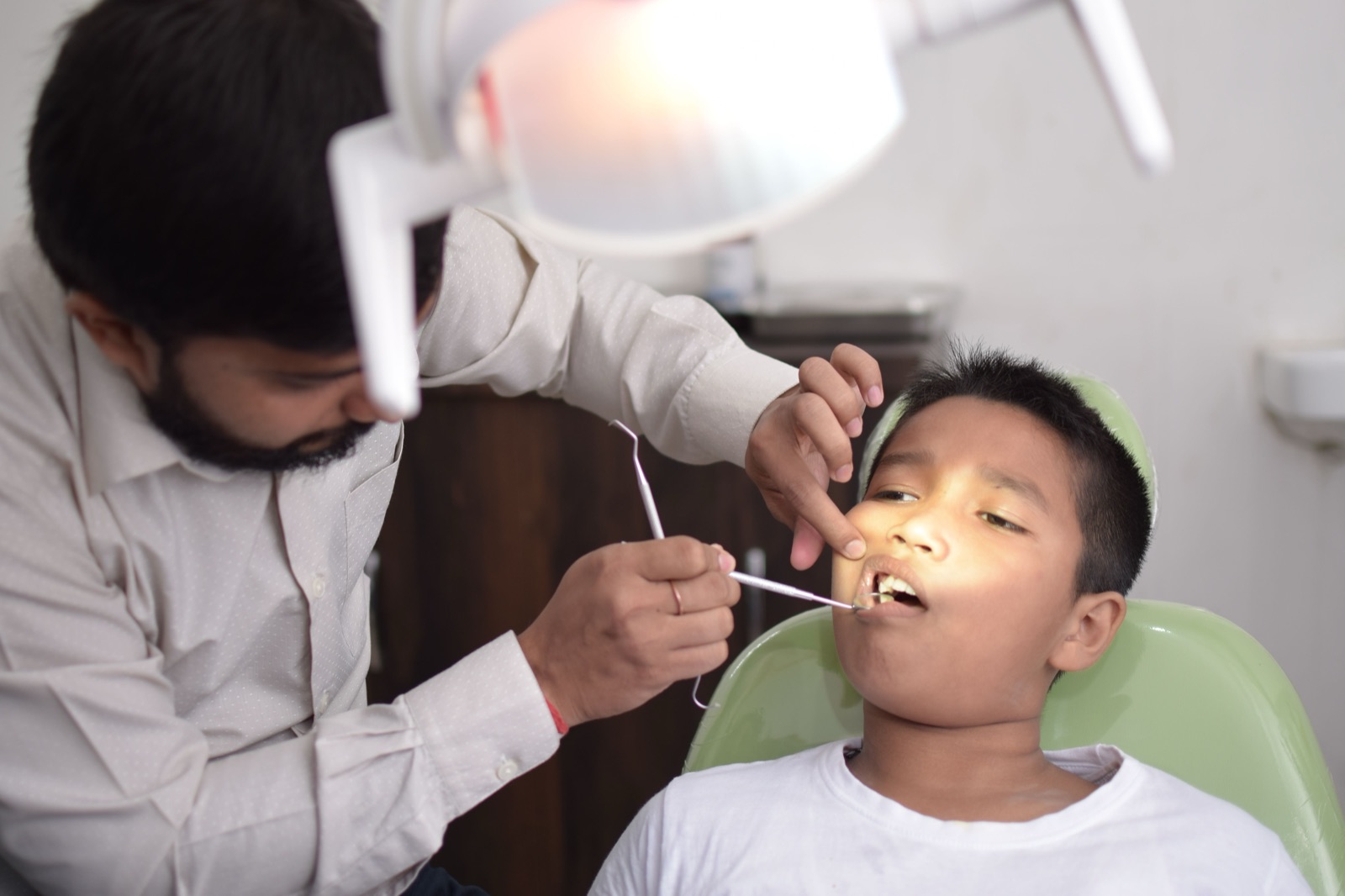A young patient receiving gentle dental care