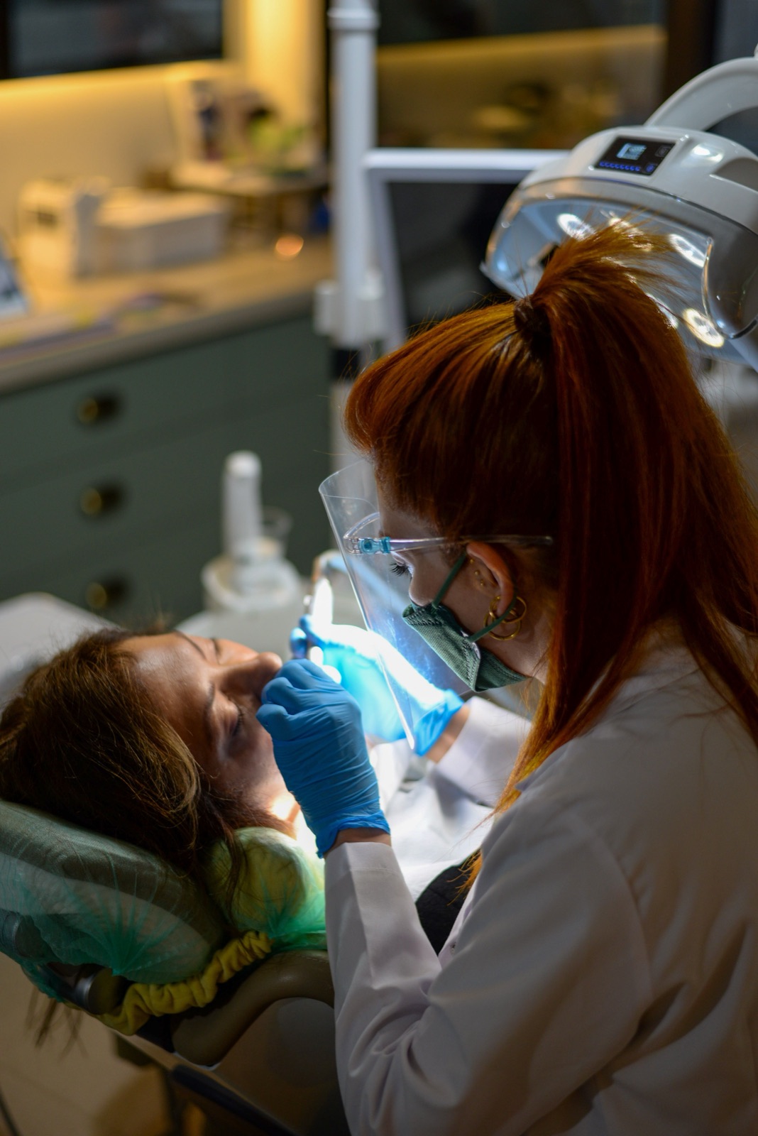 Dental procedure underway in a modern treatment room